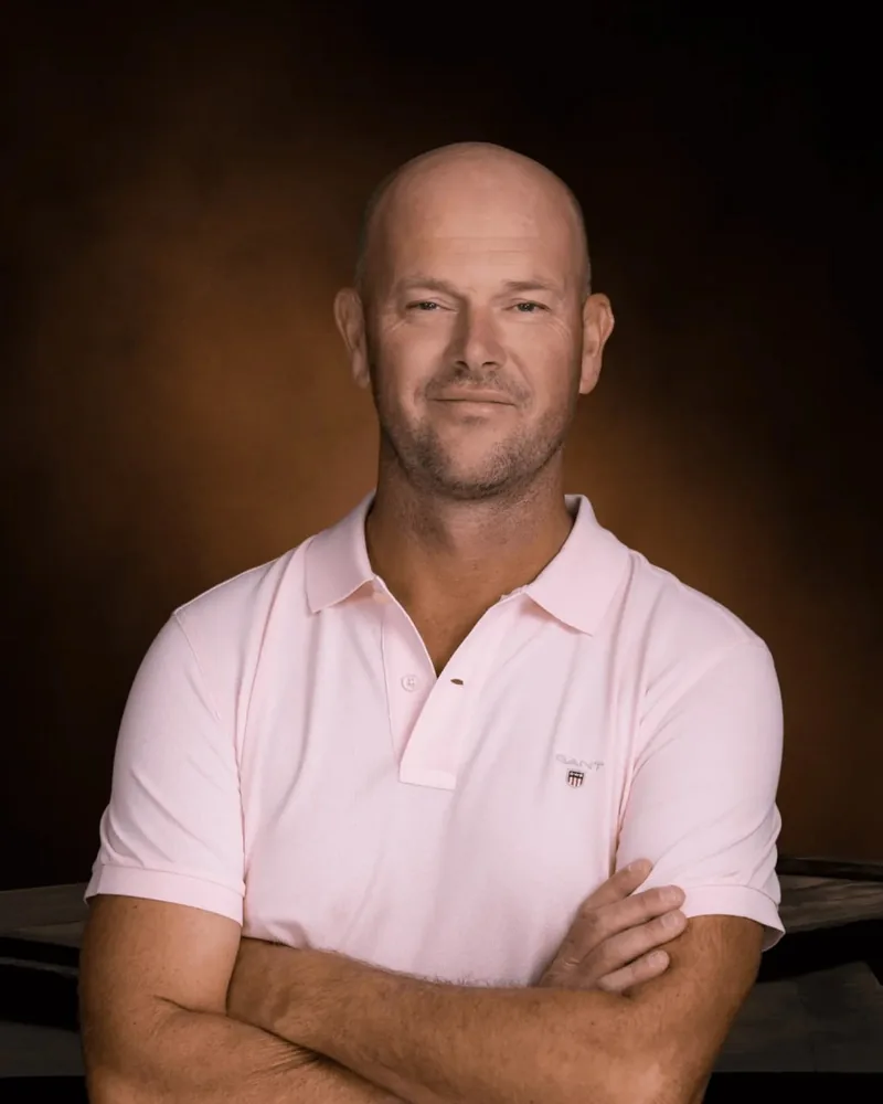 Todd, who runs Perth Microcement, standing with his arms folded